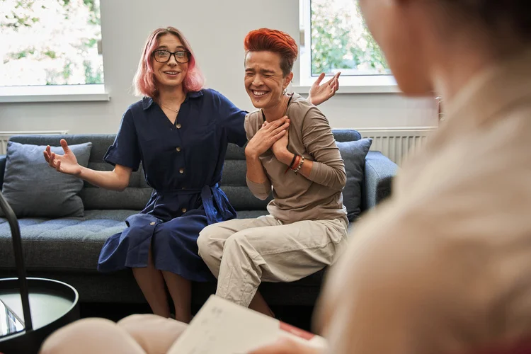 a group of women sitting on a couch
